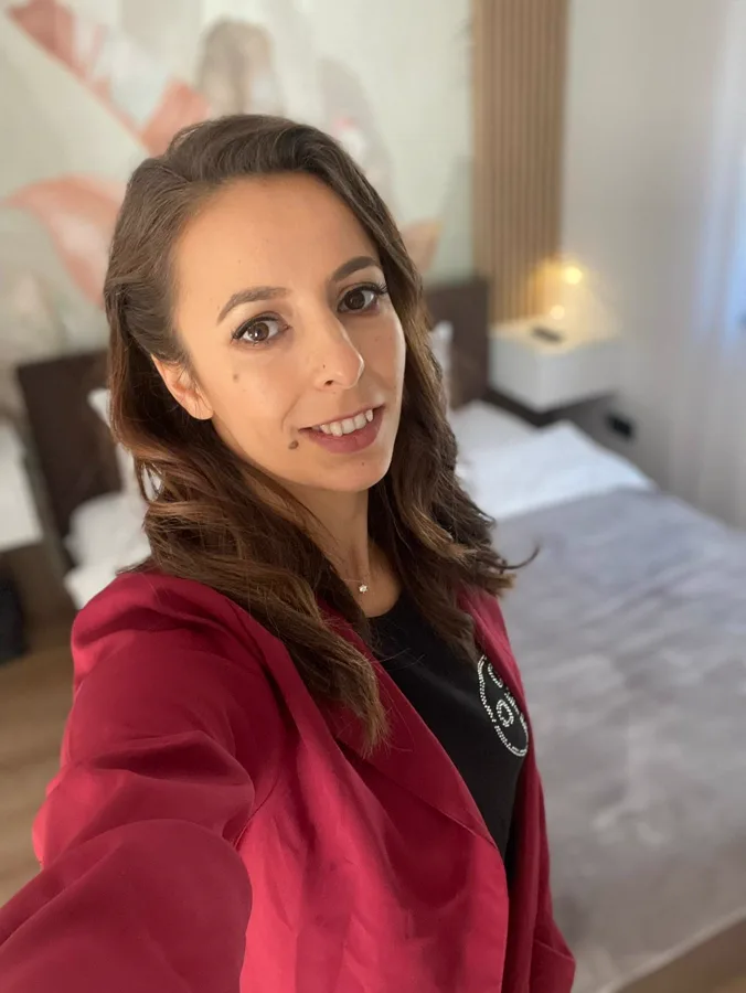 Your host at Casa Frătilă — bedroom with tropical wallpaper